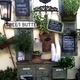 Water Display Stand With Clever Chalkboards Displaying Positive Phrases, Inspirational Signs and Fre - Exterior at Sweet Butter Kitchen
