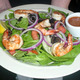 Spinach Salad Topped with Onion, Tomoato, Chopped Egg and Bacon Bits added shrimp for $2.00 extra at DuckTales Kitchen