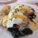 Crab cakes topped with poached eggs, Hollandaise, spicy red pepper butter, and Dauphinoise potatoes - Crabe et Oeufs Poches at Lake Park Bistro