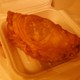 A pastry filled with chicken and spices. - Karee Bap at Kapow Thai Cuisine