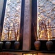 Huge Wall Sculptures Are Enhanced With Uplights As It grown Darker - Exterior at RockSugar Pan Asian Kitchen
