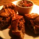 Fried bread dough stuffed with pulled pork and queso blanco, served with Talara salsa and harissa ma - Pork Empanada at Talara