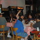 Some of our Customers having a great time eating & playing games. - Photo at Coscino's Pizza