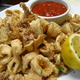 Antonios fried calamari. Lightly battered, nice and crispy with a side of lemon and marinara sauce - Antonios Fried Calamari at Antonios Pizza & Italian Restaurant