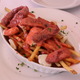 Fries, cheese curds, and sausage with a creme sauce - Poutine Malik at Restaurant Soleil