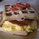 Bacon, Sausage, Egg & Cheese Wrapped in between Two Waffles - Bobo Sandwich at Rail Grill
