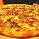 It's a big, tasty pizza - Drag it through the garden at Joey Nova's