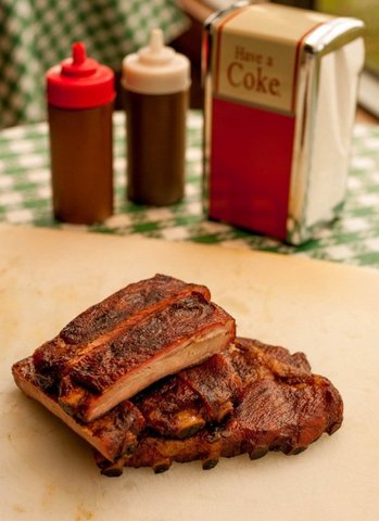 Side view of ribs. Our “Best Ribs in Texas” do not need any sauce at all, but we do offer our origin - More ribs at Cokers Barbecue