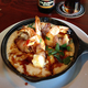 Candied Bacon Wrapped Shrimp in Whipped Polenta at The Monk's Kettle