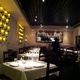 View of one of the dining rooms at Kyma. - Interior at Kyma