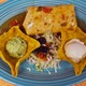 Chimichanga - Flour tortilla rolled w beef or chicken & beans, deep fried & topped w chili verde.  - Chimichanga at Cintia's of Mexico Restaurant
