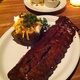 Delectable Fall-off-the-Bone BBQ Ribs and Overstuffed Baked Potato - Barbeque Ribs with Stuffed Baked Potato at Houston's