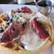 on a Belgian waffle - Smoked Kielbasa and Eggs at Cafe Hollander